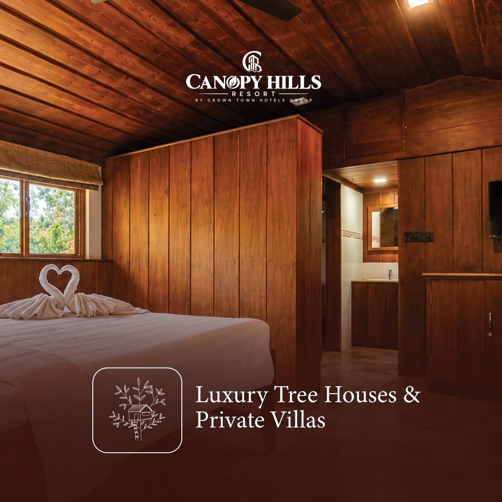 Wooden-panelled luxury tree house and private villa room at Canopy Hills Resort Munnar in Anachal, with a decorated bed, a window with green views, an attached bathroom and a TV, ideal for a couple stay or family stay in Munnar.